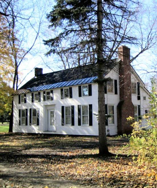 Color photograph of the front and right side of the Flint House in 2003