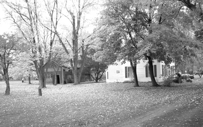 Photograph of the Flint House and barn in 2003.