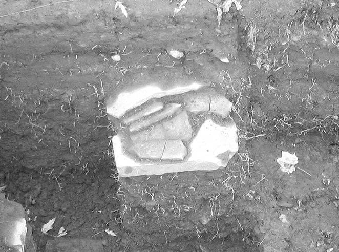 Stones from the Flint House archaeological excavation in porch square I2